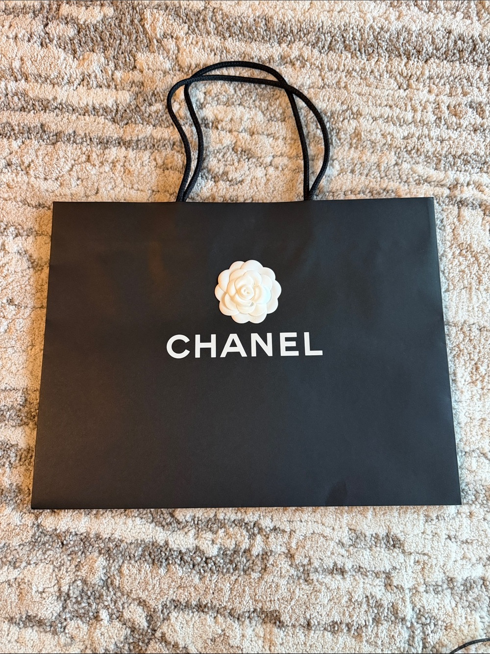 CHANEL Black Shopping Bag with White Camellia Accent